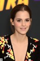A woman in a black dress posing for a picture.